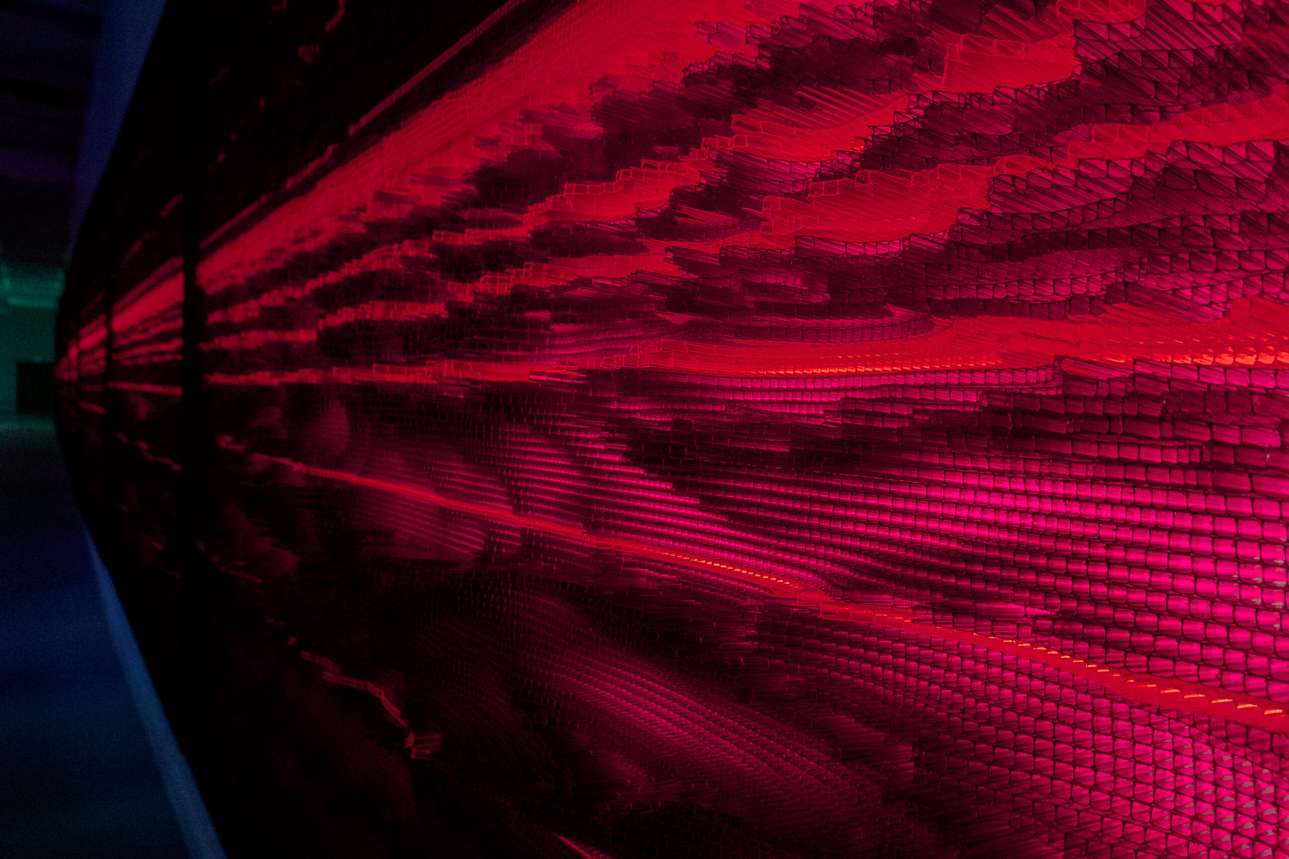 Colorful technology design wallpaper on toning Viva Magenta. Creative composition with cells lines in row on wall composition, abstract background. Trendy design of 2023